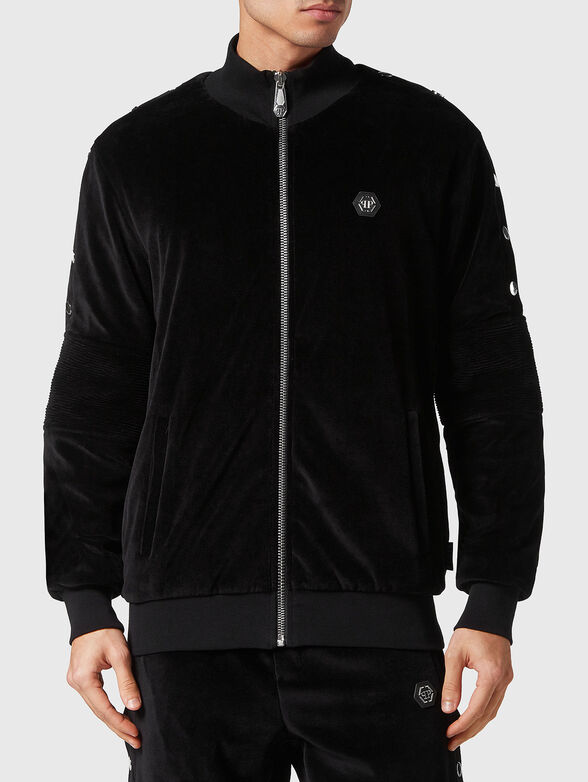 Logo patch sweatshirt in black - 1