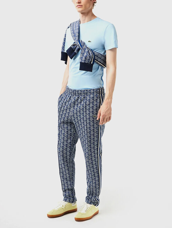 Sports trousers with monogram print - 6