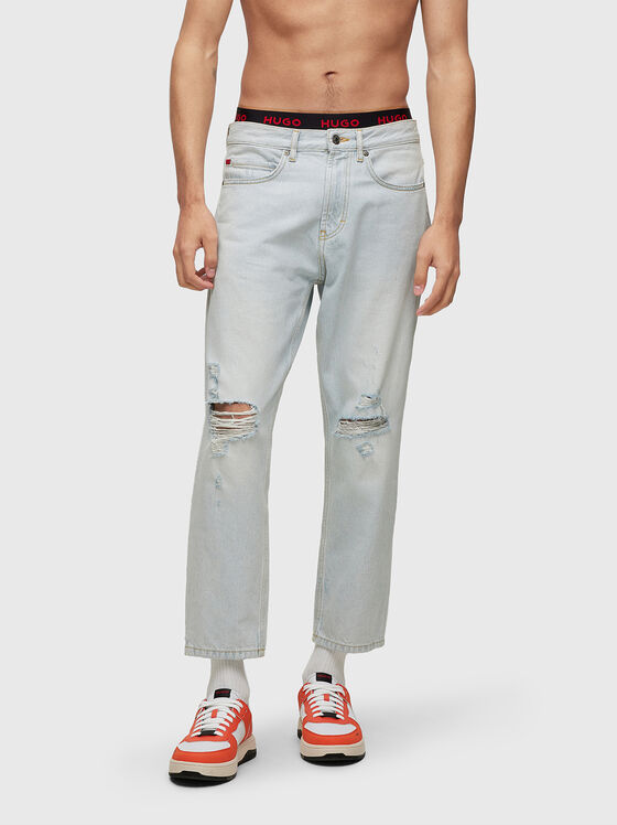 Light blue jeans with distressed effect - 1