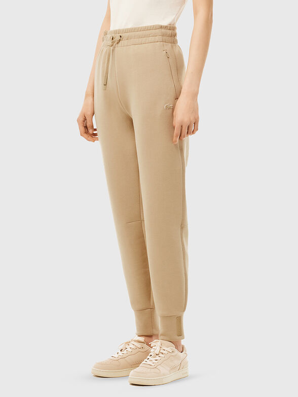 Beige sweatpants with logo details - 1