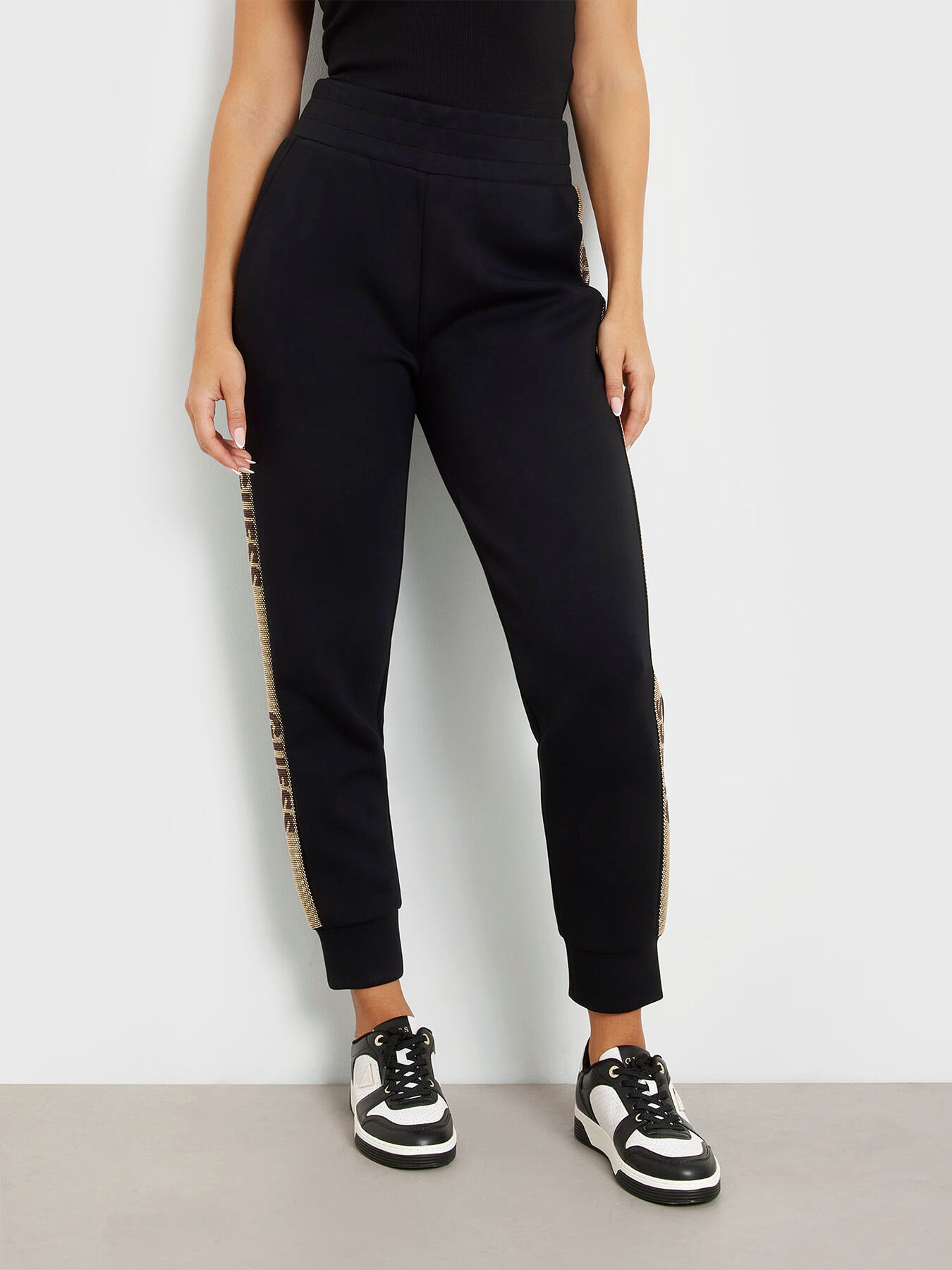 Sports pants with studs stripes brand GUESS Globalbrandsstore en