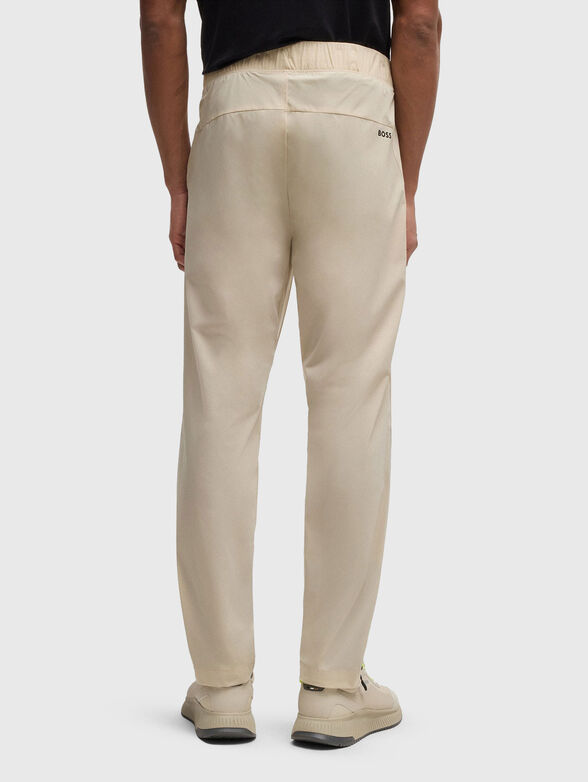 Sport trousers with an accent zip and logo - 2