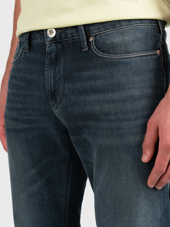 Blue jeans with metal logo accent - 4