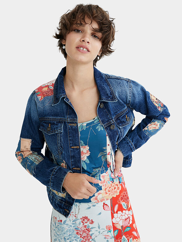 Denim jacket with floral motifs - 1
