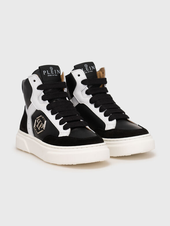 Black and white sports shoes with logo accents - 2