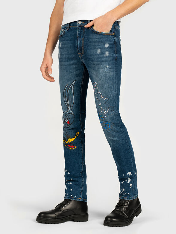 Distressed jeans with Looney Tunes design - 1