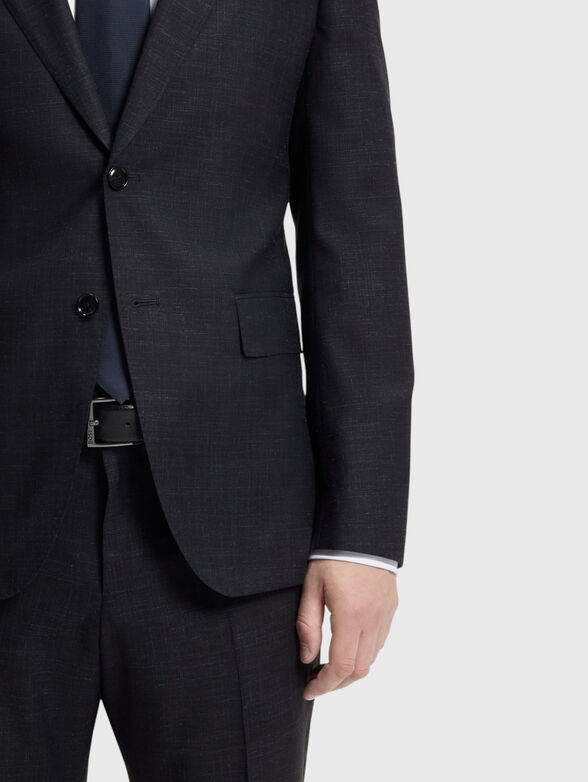 A suit made of a wool and silk blend - 6