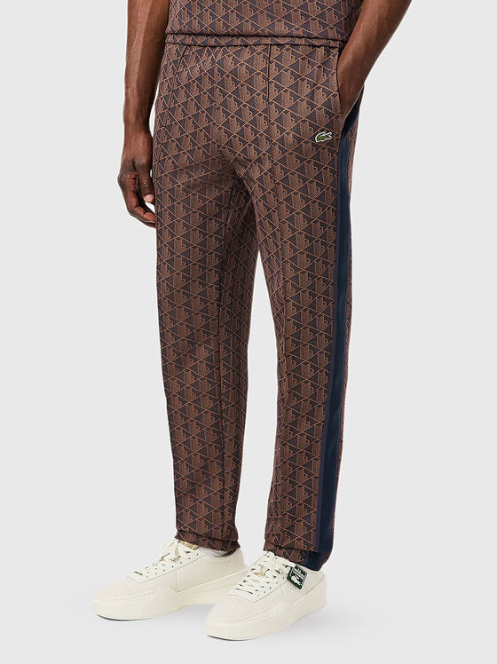 Brown sports trouser with monogram print - 1