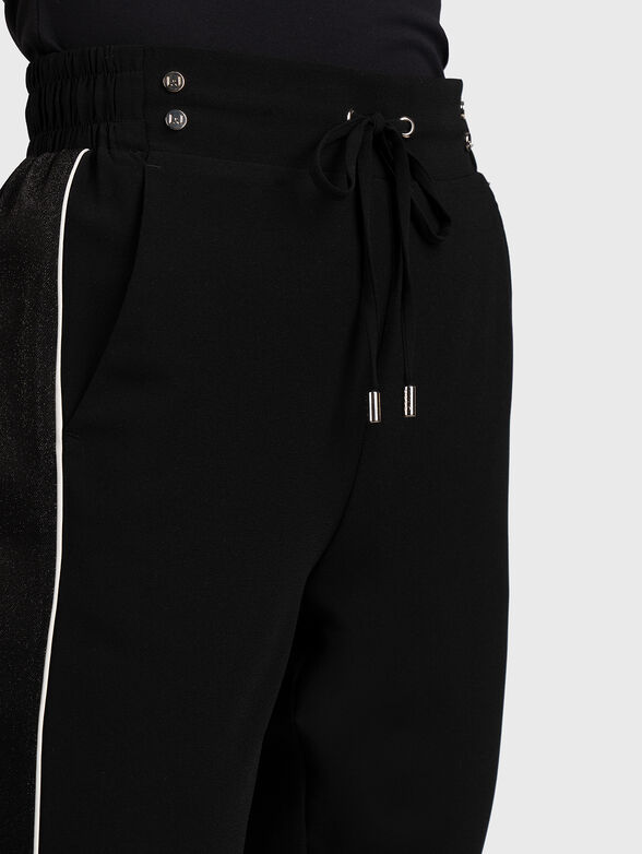 Black sports pants with shiny accent - 4