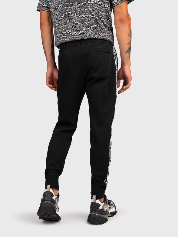 Sports trousers with logo stripe - 1
