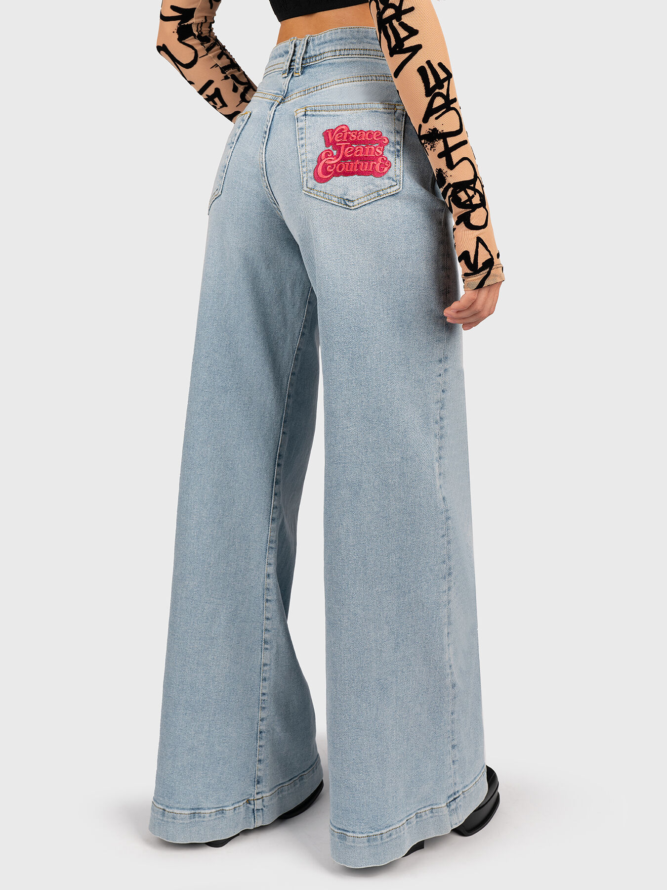 Jeans with wide legs and logo embroidery brand VERSACE JEANS