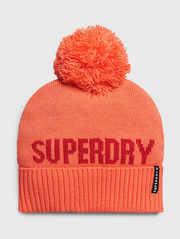 Knitted hat in coral color - 1