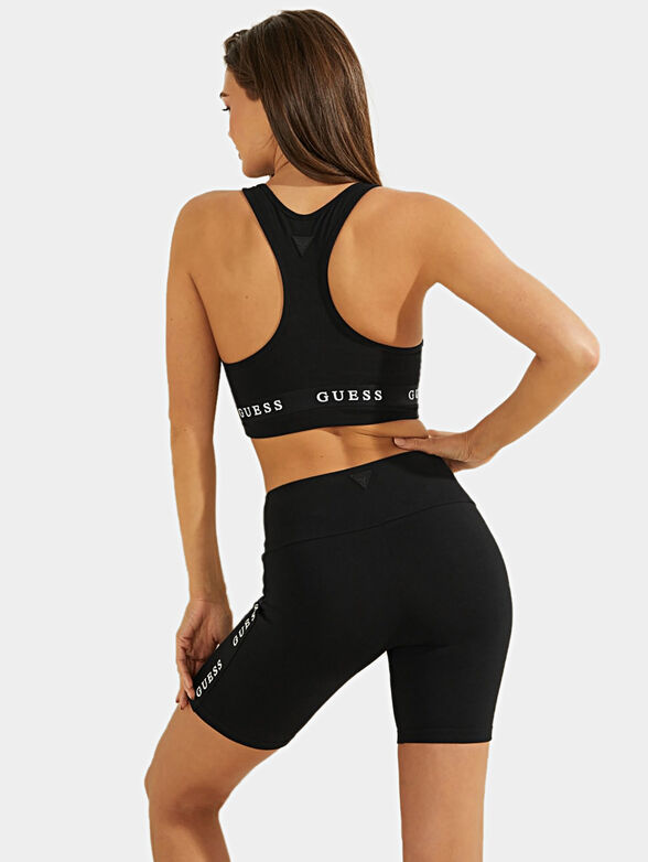 Sports bra in black color brand GUESS — /en