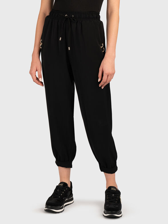 Sports trousers with golden details - 0