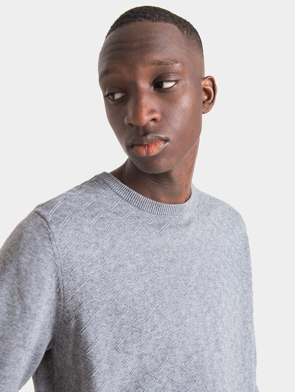 Blue sweater with art details - 2