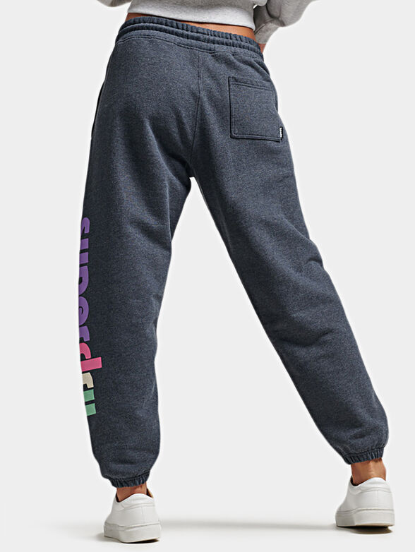 Blue sports pants with colorful logo print - 2
