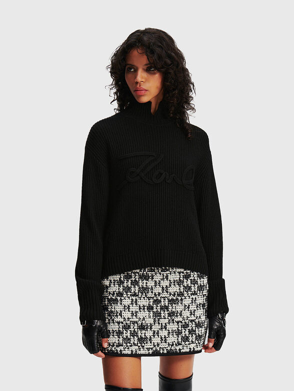 Knitted sweater in black color - 1