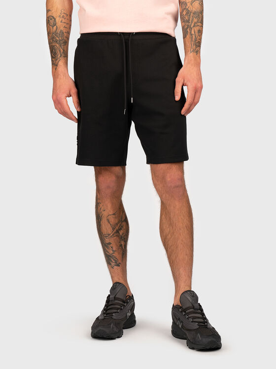 Beige shorts with embossed logo - 1