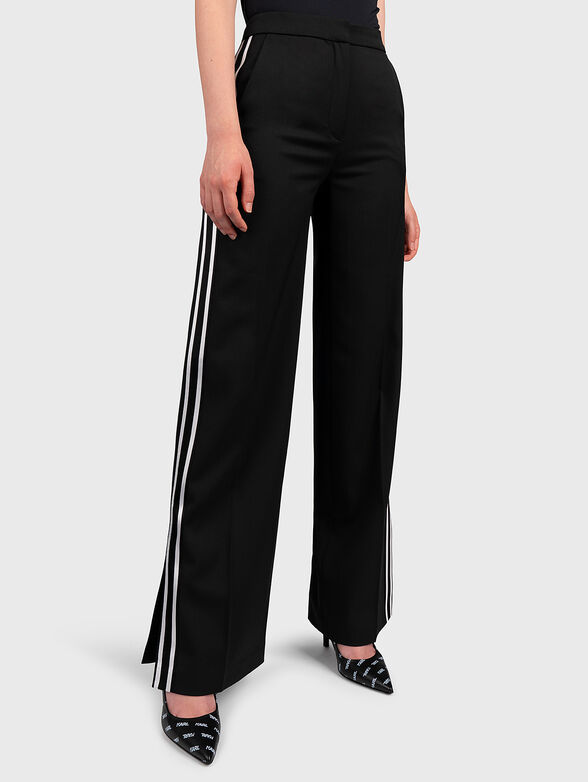 Trousers with flared legs with slits - 1