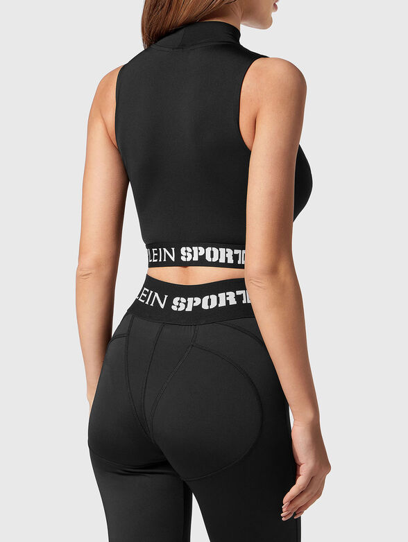 Sports top in black with cut out accent  - 3