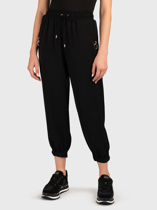 Sports trousers with golden details