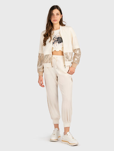 Sports trousers with sequins and logo - 5