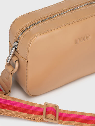 Crossbody bag with accent strap - 4