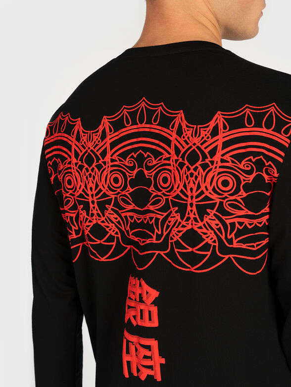 Black blouse with contrasting print - 4