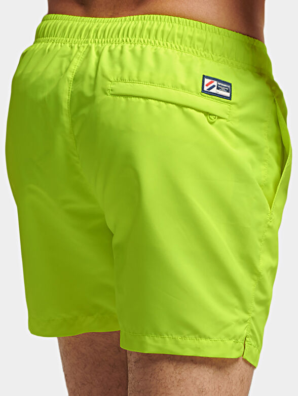 Beach shorts in neon green color - 2