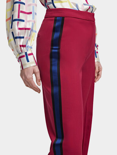 Trousers with flared legs with slits - 4