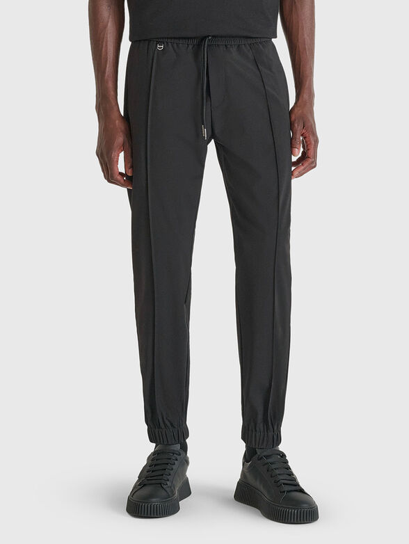 Trousers with pockets and mini logo - 1