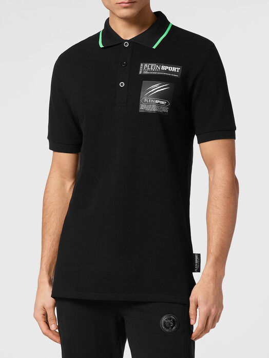 Polo shirt in black with contact logo print