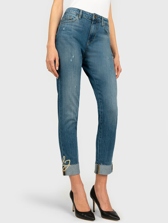 Jeans with tears and logo embroidery - 1