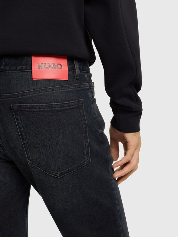 Jeans with worn effect and logo - 3