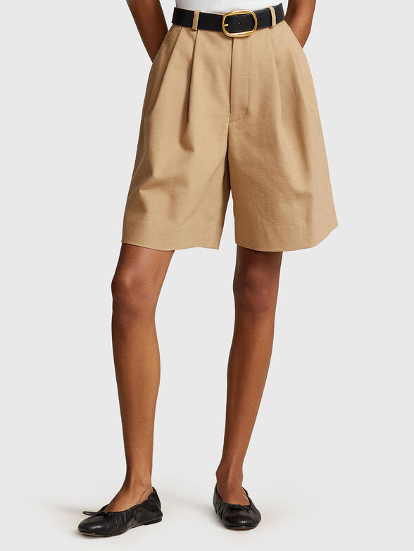 Pleated shorts in beige  - 1