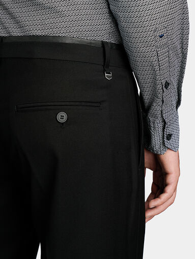 Black trousers with leather detail at the waist - 4