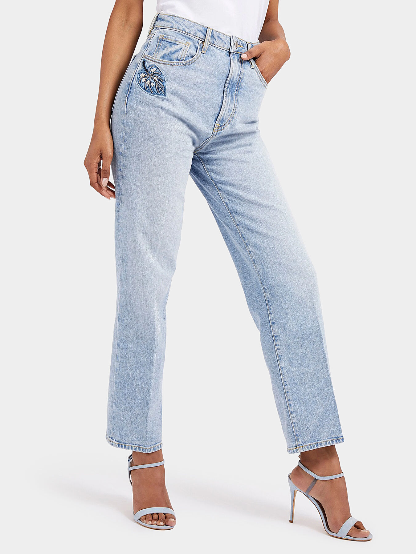 Light blue jeans with beaded accent brand GUESS