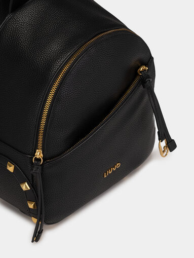 Black backpack with golden accents - 4