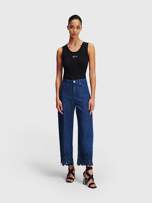 Jeans with perforations and embroidered details