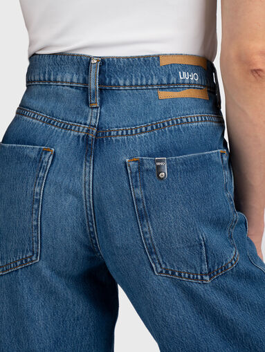 Flared jeans with side slits - 4
