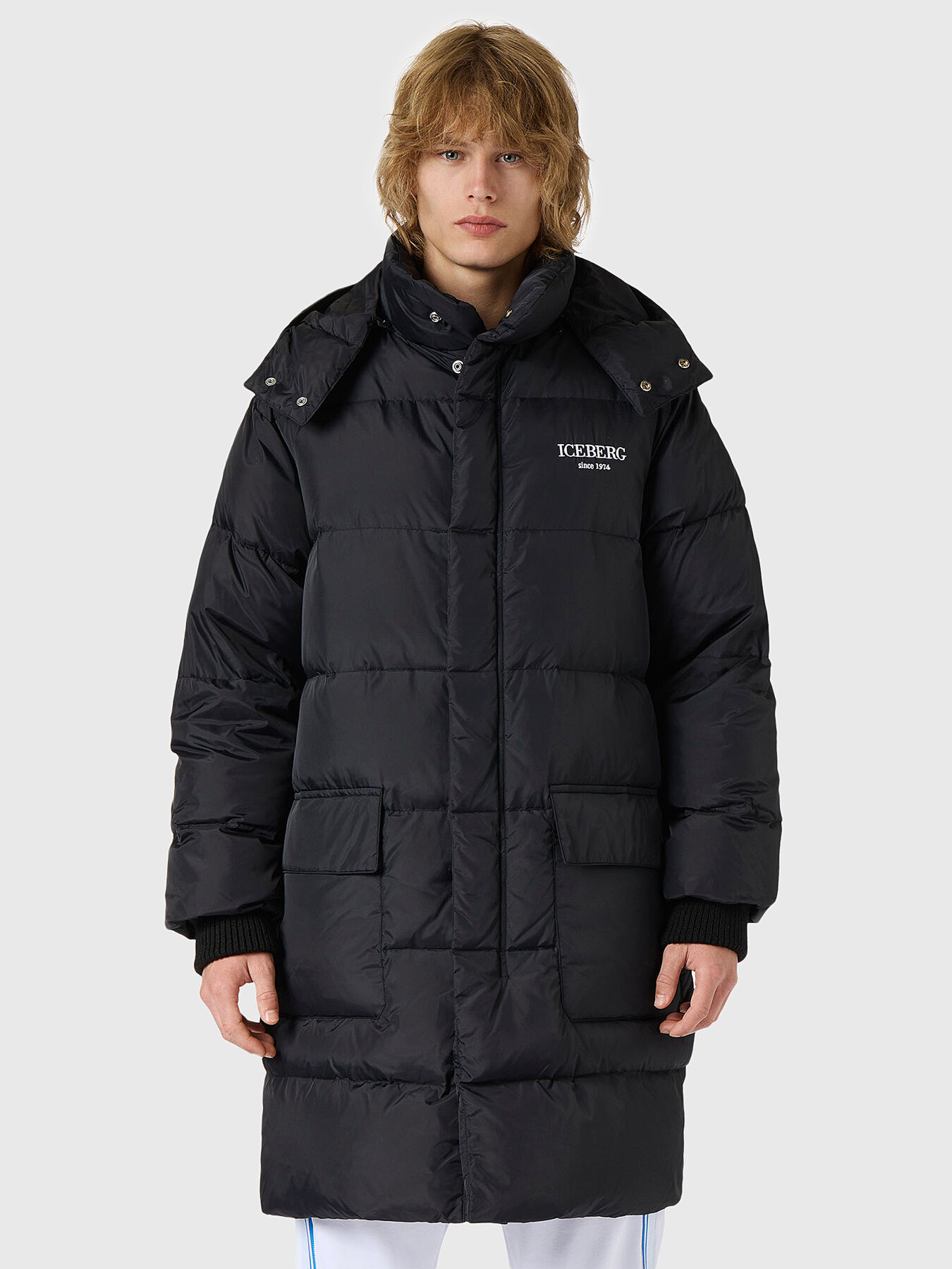 Long padded jacket with hood and embroidery on the back brand