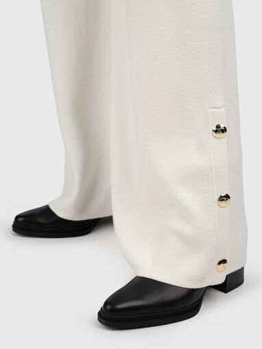 Pants with buttons on the legs - 4