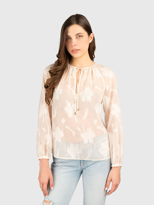 Long sleeved blouse with a sheer effect