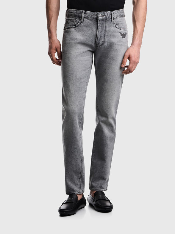 Jeans with a bleached effect and embroidered logo - 1