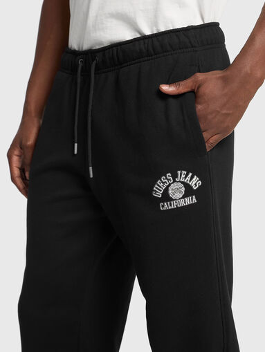 Black sports trousers  with ties at the waist - 4