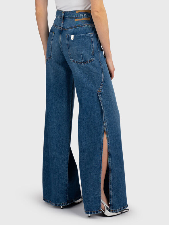 Flared jeans with side slits - 2