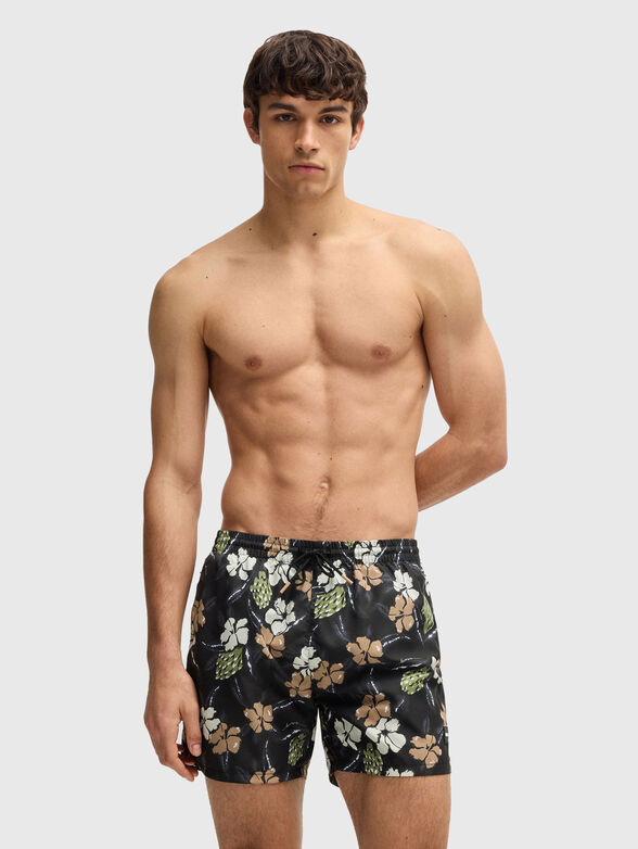 Beach shorts with floral motifs - 1