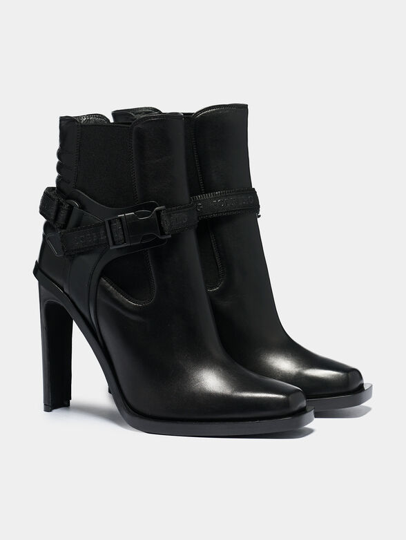 Black leather ankle boots with accent strap - 1