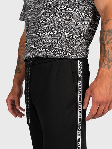 Sports trousers with logo stripe - 2