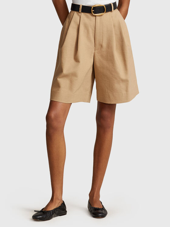 Pleated shorts in beige  - 1